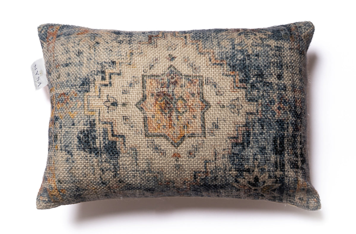 Nordhavn 13x19 boudoir cushion styled on an elegant neutral sofa
