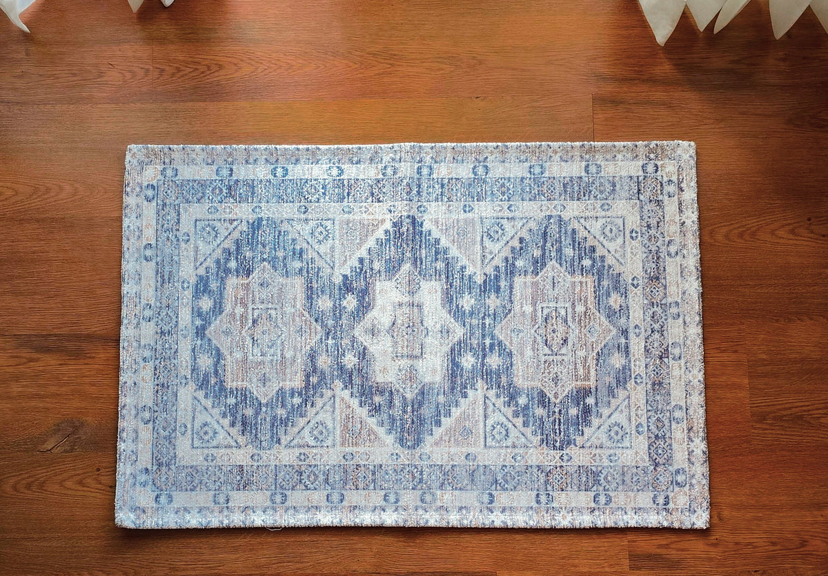 Skagen Passage indigo rug with ivory geometric medallions and weathered detailing